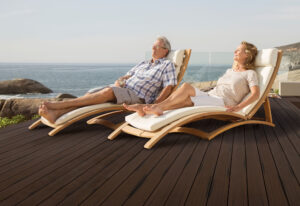 Retired Couple Relaxing on a Deck by the Ocean