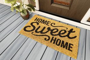 Home Sweet Home doormat on the porch at the front door.