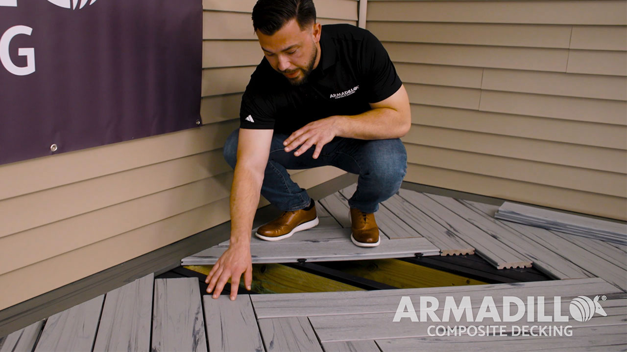 Derek pointing out joist spacing for herringbone composite decking pattern